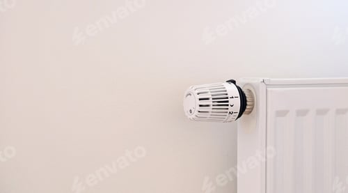 Preview: Thermostat close-up. Battery temperature controller. White heater with thermostat on the wall