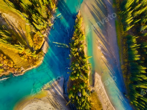 Preview: Fall landscape. A drone view of the river in the woods. An aerial view of an autumn forest.