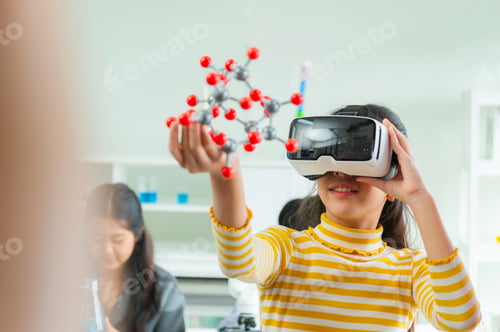 Preview: girl is holding VR headset and looking at molecule