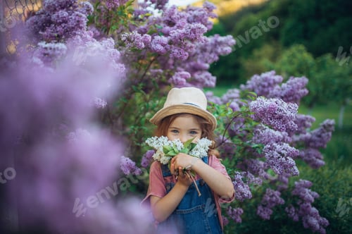 Preview: Portrait of little girl with lilac, spring mood.