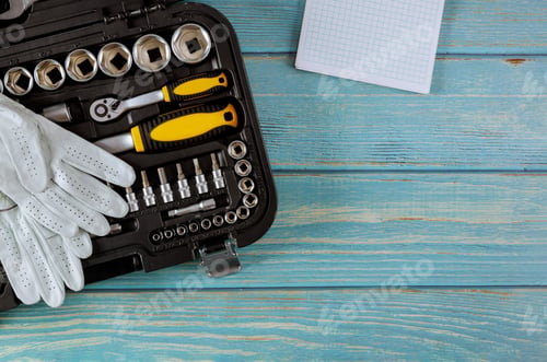 Preview: A set of hexagons of different sizes with a set wrench from a toolbox in a protective work glove