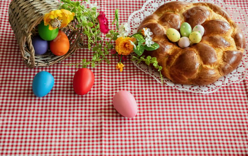 Preview: Easter sweet bread, greek tsoureki, brioche braid on table, close up view