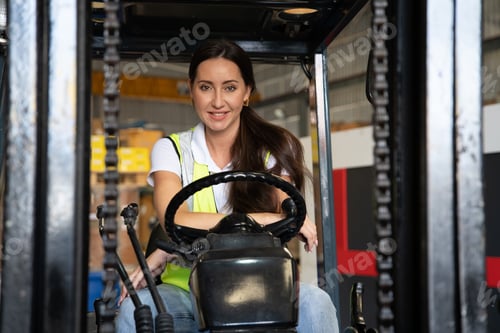 Preview: forklift operator in storage warehouse looking way during transport goods to storage shelf area