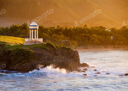 Preview: Gazebo and palm trees along the shore in the Caribbean Sea.