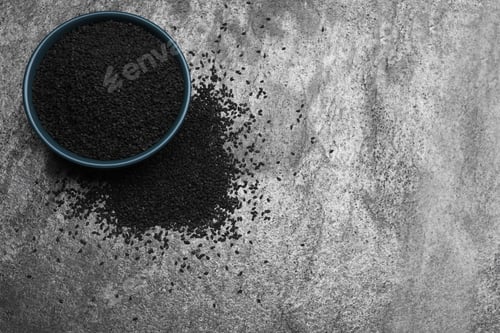 Preview: Bowl and black sesame on grey table, flat lay. Space for text