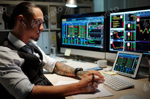 Preview: Broker reviewing trades