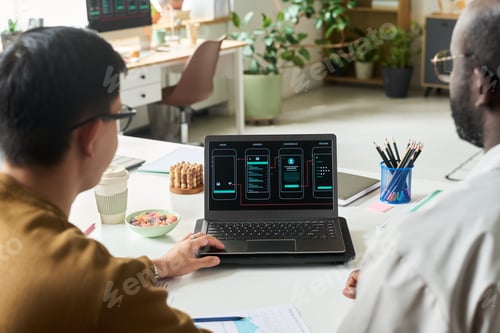 Preview: Multiethnic Men Collaborating on Mobile App Interface Design