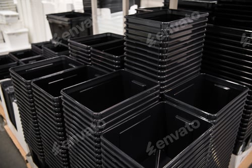 Preview: Black plastic box containers in row at store