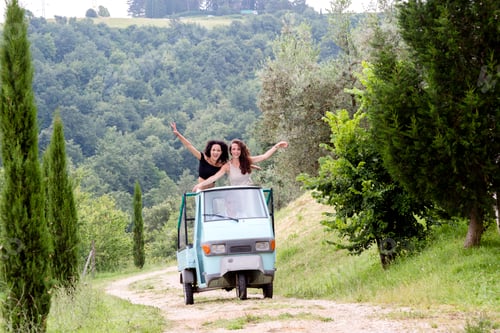 Preview: Friends on three-wheeler vehicle, Città della Pieve, Umbria, Italy