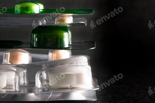 Preview: pharmaceuticals pills and antibiotics a black background