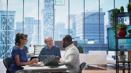 Preview: Mature couple engaged in a serious discussion with a financial banker