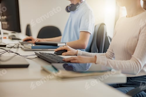 Preview: Close up of university student using computer studying in computer room