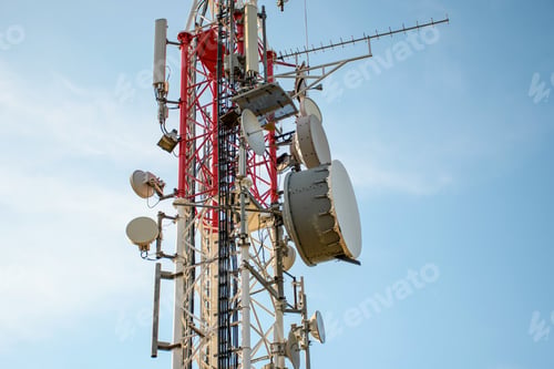 Preview: Low angle view of Antenna tower against a blue sky. 5g network cell tower.
