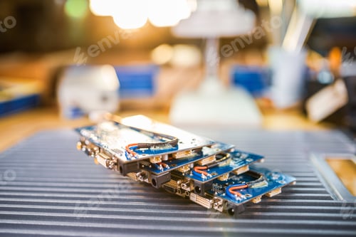 Preview: Close-up electric green embedded microcircuits in production