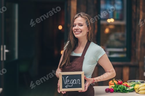 Preview: Young girl with a plate in the kitchen