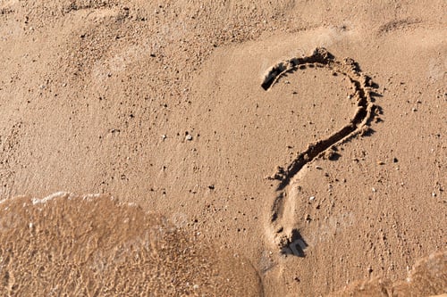 Preview: Question mark sign on sand beach near the sea. Concept of dilemma, answer and question