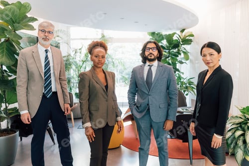 Preview: Italy, Portrait of business people standing in creative studio
