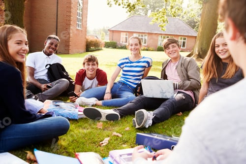 Preview: Teenage Students Sitting Outdoors And Working On Project