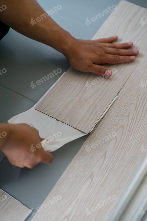 Preview: Vinyl floor installation, worker, DIY at home.
