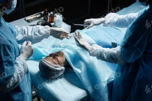 Preview: Medical Team Performing Delicate Surgery in Operating Room