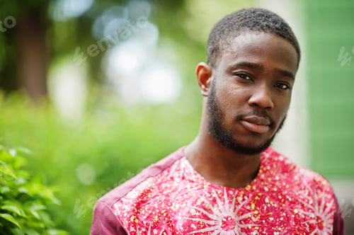 Preview: Black young man wearing african traditional clothes