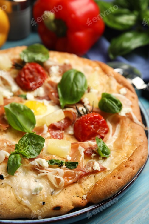 Preview: Delicious homemade pita pizza on light blue wooden table, closeup