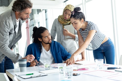 Preview: Front view of diverse business people working together at conference room in a modern office