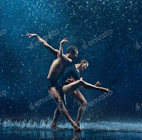 Preview: Young couple of ballet dancers dancing unde rwater drops