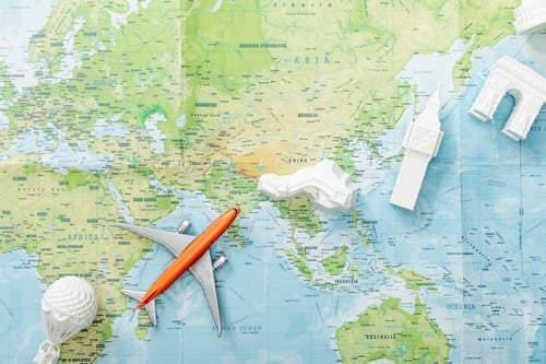Preview: top view of small plane on map near world attractions