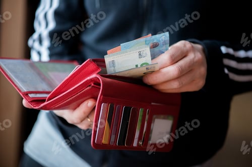 Preview: Person Holding Wallet With Cash And Cards