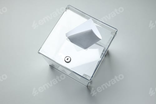 Preview: Voting box with papers on gray background, top view