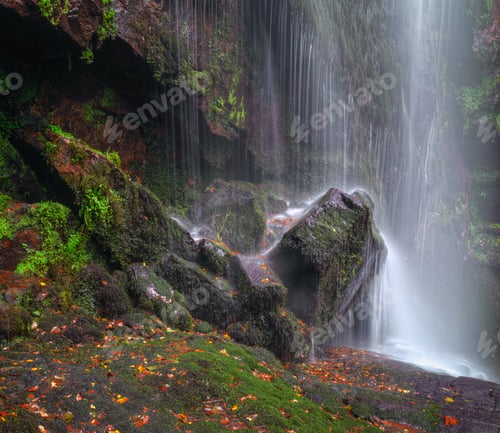 Preview: Waterfall on a rock covered with moss