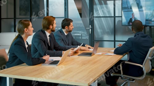 Preview: Young people communicating via video call in the office