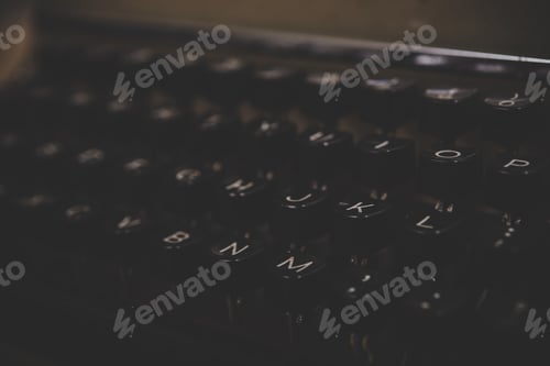 Preview: Vintage typewriter on wooden table.