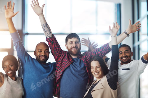 Preview: Winning is what we do. Portrait of a group of young colleagues cheering at work.