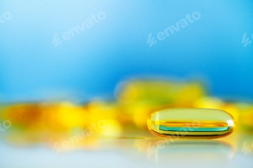 Preview: Omega 3 fish oil yellow soft gel capsules.