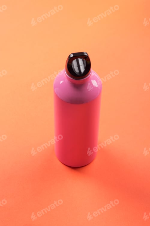 Preview: Pink thermos on orange coral.