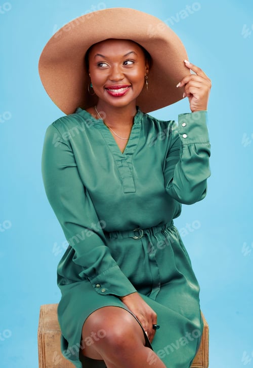 Preview: Fashion, thinking and happy black woman with cool style for summer isolated in a studio blue backgr