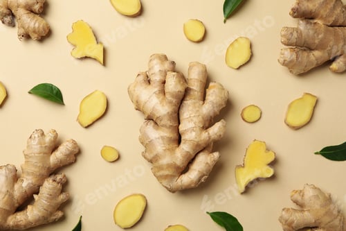 Preview: Fresh ginger and leaves on beige background, top view