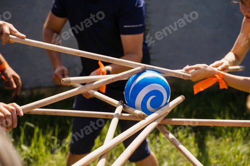 Preview: Team building game with ball and sticks for group cohesion