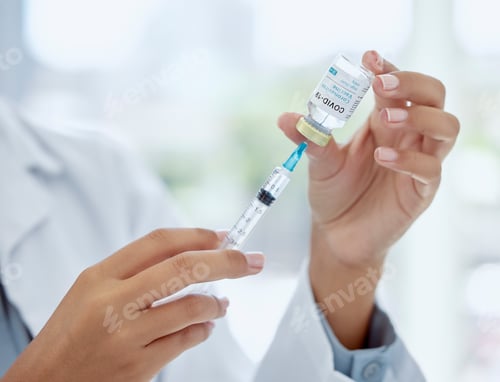 Preview: Covid, medicine and vaccine with hands of doctor holding syringe and glass vial for healthcare, pha