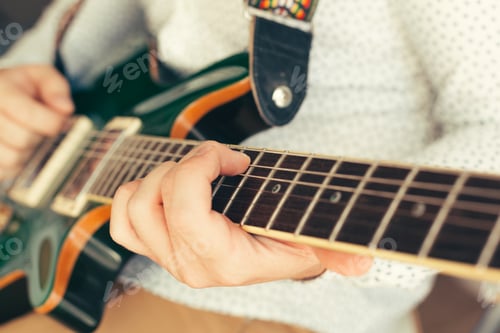 Preview: man playing electric guitar