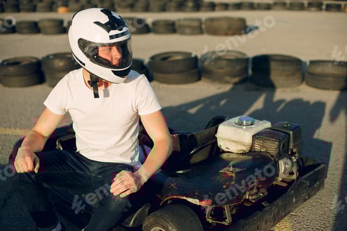 Preview: Handsome man in a karting with a car