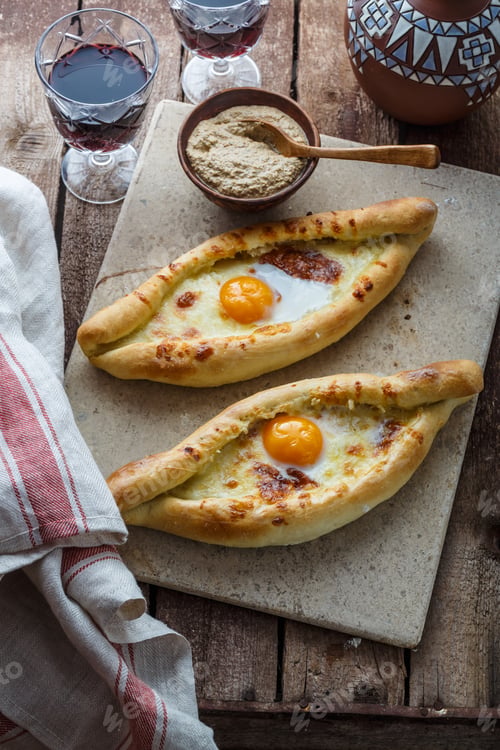 Preview: Two ajarian khachapuri, georgian bread with cheese and yolk