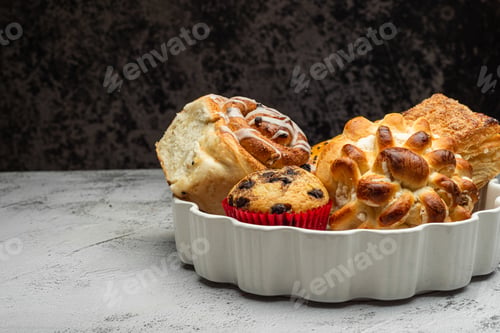 Preview: Close-up of a white plate with different freshly baked desserts