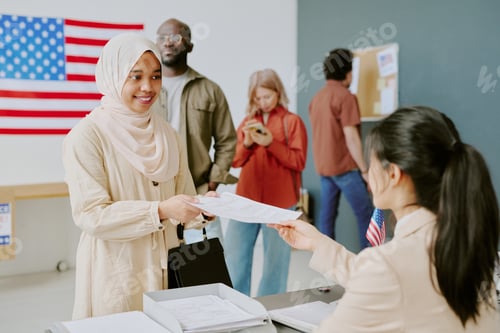 Preview: Woman In Hijab Taking Ballot Paper