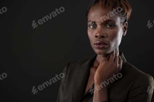 Preview: Androgynous man posing with hand on his neck