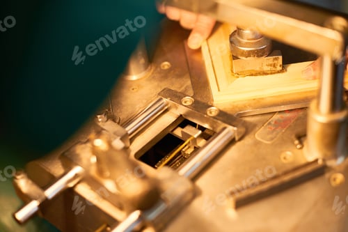 Preview: Man Assembling Wooden Frame Using Industrial Machine