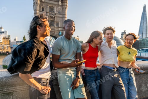 Preview: Multiracial group of happy young friends bonding in London