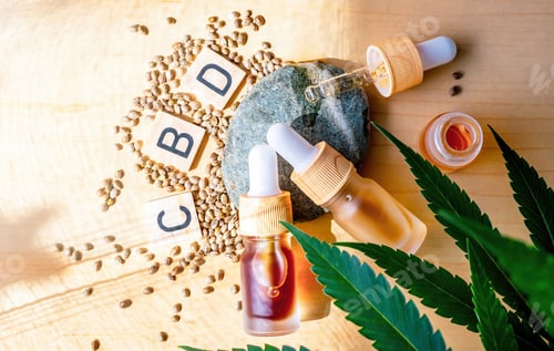 Preview: Flat lay bottles with Cannabis CBD oil letters with Medical Marijuana plant leafs and Hemp Seeds